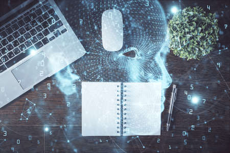 Double exposure of brain drawing hologram over topview work table background with computer. Concept...