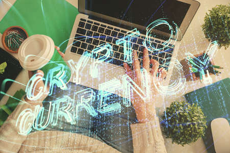 Double exposure of woman hands working on computer and blockchain theme hologram drawing. Top View....