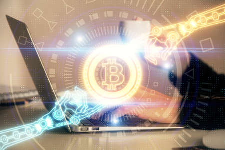 Double exposure of woman hands typing on computer and crypto market theme hologram drawing....