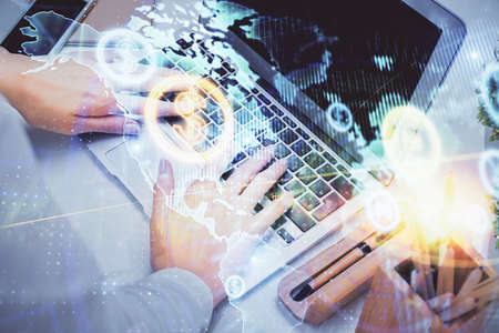 Double exposure of woman hands typing on computer and forex chart hologram drawing. Stock market...