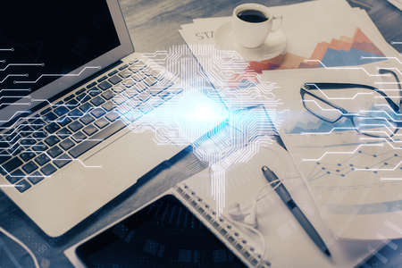 Double exposure of desktop with computer and brain drawing hologram. Artificial intelligence...