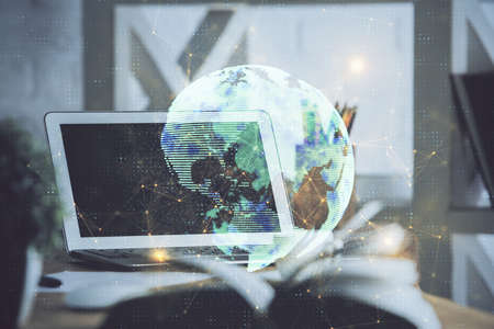 Computer on desktop with social network hologram. Double exposure. Concept of international people...