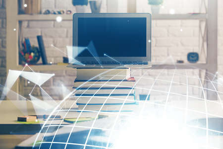 Double exposure of desktop with computer and world map hologram. International data network concept.