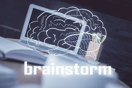 Desktop computer background in office and start up theme hologram drawing. Double exposure. Startup concept.の写真素材