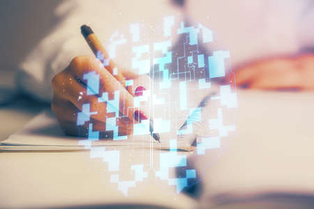 Multi exposure of woman's writing hand on background with data technology hologram. Concept of...