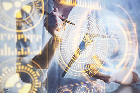 Tech theme hologram over woman's hands taking notes background. Concept of hightech. Double exposure