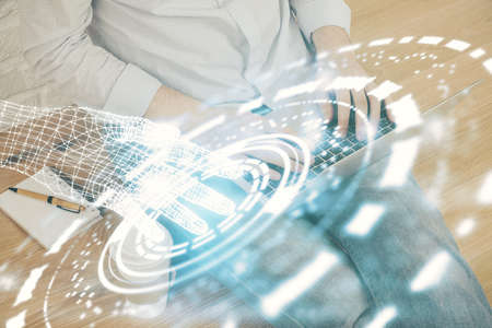 Multi exposure of technology hologram with man working on computer background. Concept of big data.