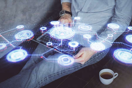 Media network theme hologram with man working on computer on background. Concept of internet...