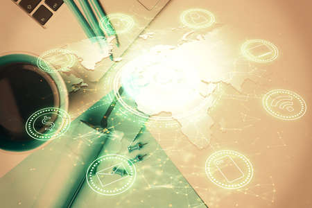 Social network hologram drawings over computer on the desktop background. Top view. Multi exposure....