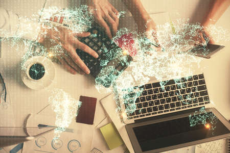 Double exposure of man and woman working together and social network theme hologram drawing....