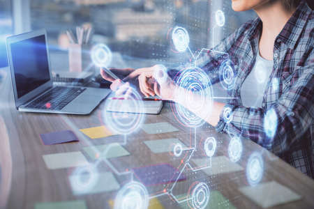 Multi exposure of woman hands working on computer and data theme hologram drawing. Tech concept.