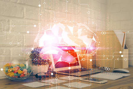 Double exposure of work space with computer and human brain drawing hologram. Brainstorm concept.