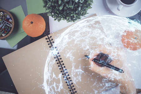 Social network theme hologram over hands taking notes background. Concept of global international...