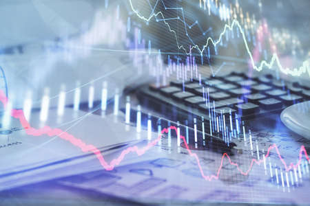 Double exposure of financial chart drawings and desk with open notebook background. Concept of forex...