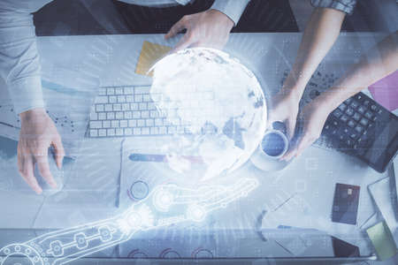 Double exposure of man and woman working together and world map hologram drawing. international...