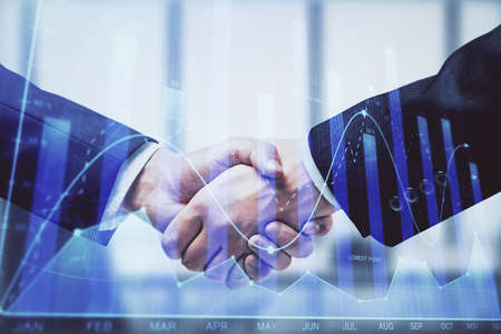 Double exposure of forex graph hologram and handshake of two men. Stock market concept.
