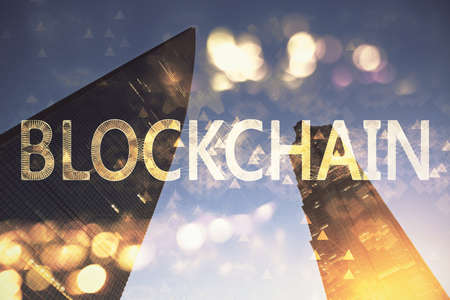 Multi exposure of cryptocurrency theme hologram drawing and city veiw background. Concept of blockchain and bitcoin.の写真素材