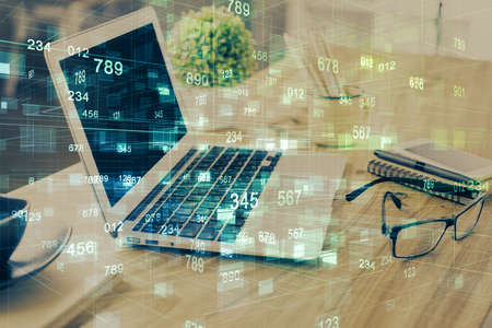 Double exposure of table with computer on background and data theme drawing. Concept of innovation.
