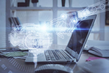 Multi exposure of work table with computer and brain hologram. Brainstorm concept.