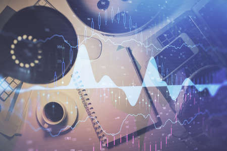 Multi exposure of forex chart drawing and work table top veiw. Concept of financial analysis.