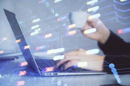 Multi exposure of woman hands working on computer and data theme hologram drawing. Tech concept.