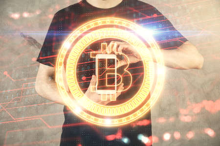 Double exposure of man's hands holding and using a phone and crypto currency blockchain theme drawing.の写真素材