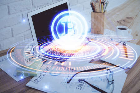 Double exposure of blockchain and crypto economy theme hologram and table with computer background. Concept of bitcoin cryptocurrency.の写真素材