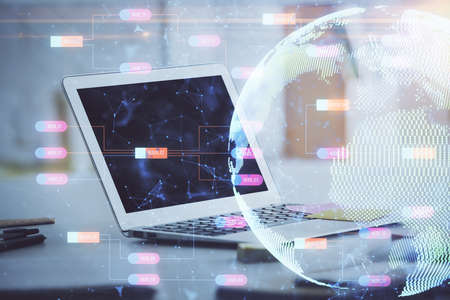 Multi exposure of table with computer and world map hologram. International data network concept.