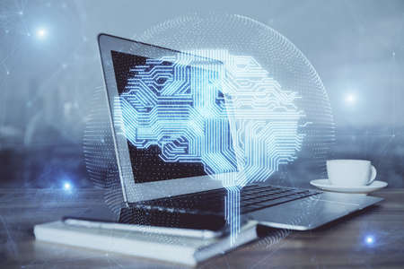 Multi exposure of work table with computer and brain hologram. Brainstorm concept.