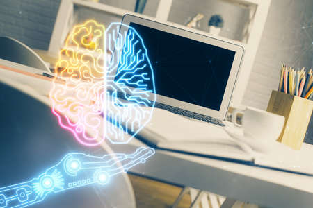 Double exposure of work space with computer and human brain drawing hologram. Brainstorm concept.