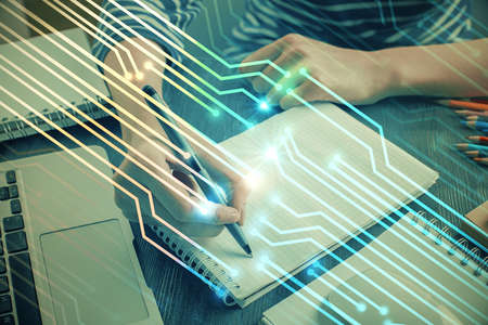 Double exposure of hands making notes with digital coding icons. Computer learning concept.
