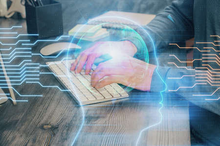 Man with computer background with brain theme hologram. Concept of brainstorm. Double exposure.