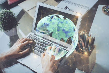 Media network theme hologram with man working on computer on background. Concept of internet communication. Double exposure.の写真素材