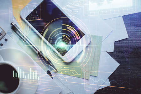 Double exposure of technology theme drawing over work table desktop. Top view. Global data analysis...