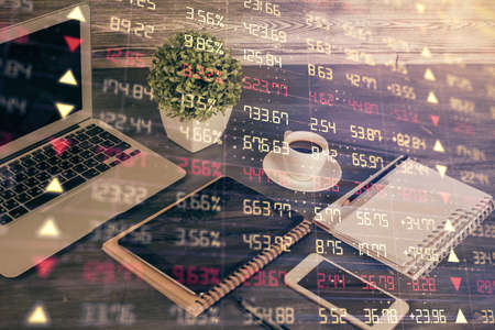 Double exposure of financial graph drawing and cell phone background. Concept of forex tradingの写真素材