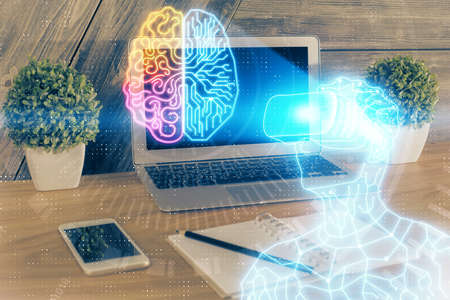 Computer on desktop with AR theme icon. Multi exposure. Concept of augmented reality.の写真素材