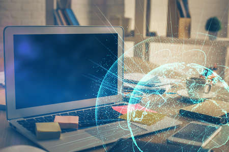 Computer on desktop with social network theme icon. Multi exposure. Concept of international connections.の写真素材