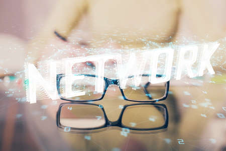 Double exposure of writing hand on background with data solution technology hologram. Ai concept.