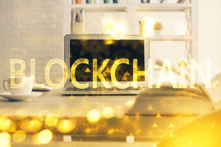 Multi exposure of blockchain theme hologram and table with computer background. Concept of bitcoin crypto currency.の写真素材