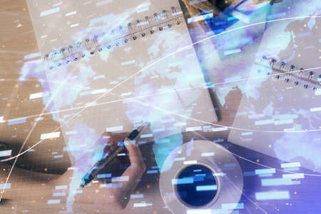 Multi exposure of woman's writing hand on background with data technology hud. Concept of...