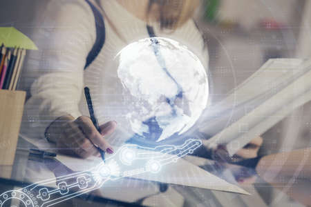 Multi exposure of hands making notes with world map hologram and data theme icons. Concept of global...