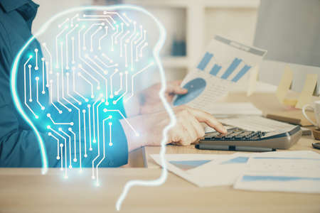 Man with computer background with brain theme hologram. Concept of brainstorm. Double exposure.