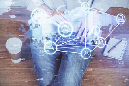 Media network theme hologram with man working on computer on background. Concept of internet...