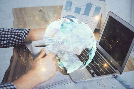 Media network theme hologram with man working on computer on background. Concept of internet communication. Double exposure.の写真素材
