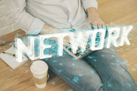 Multi exposure of technology hologram with man working on computer background. Concept of big data.の写真素材