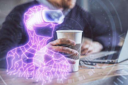 AR hologram with man working on computer on background. Augmented reality concept. Double exposure.の写真素材