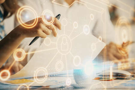 Double exposure of social network theme drawing over people taking notes background. Concept of...