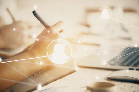 Double exposure of social network theme drawing over people taking notes background. Concept of...