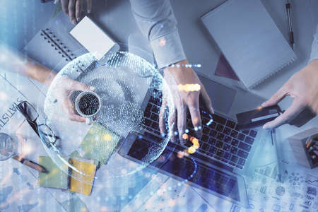 Double exposure of man and woman working together and world map hologram drawing. international...