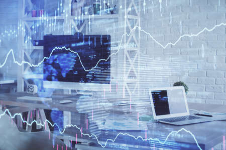 Double exposure of financial graph drawing and office interior background. Concept of stock market.